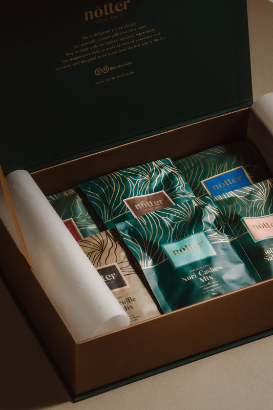 12 packs of thoughtfully crafted premium mixed nuts, presented in our signature award-winning packaging